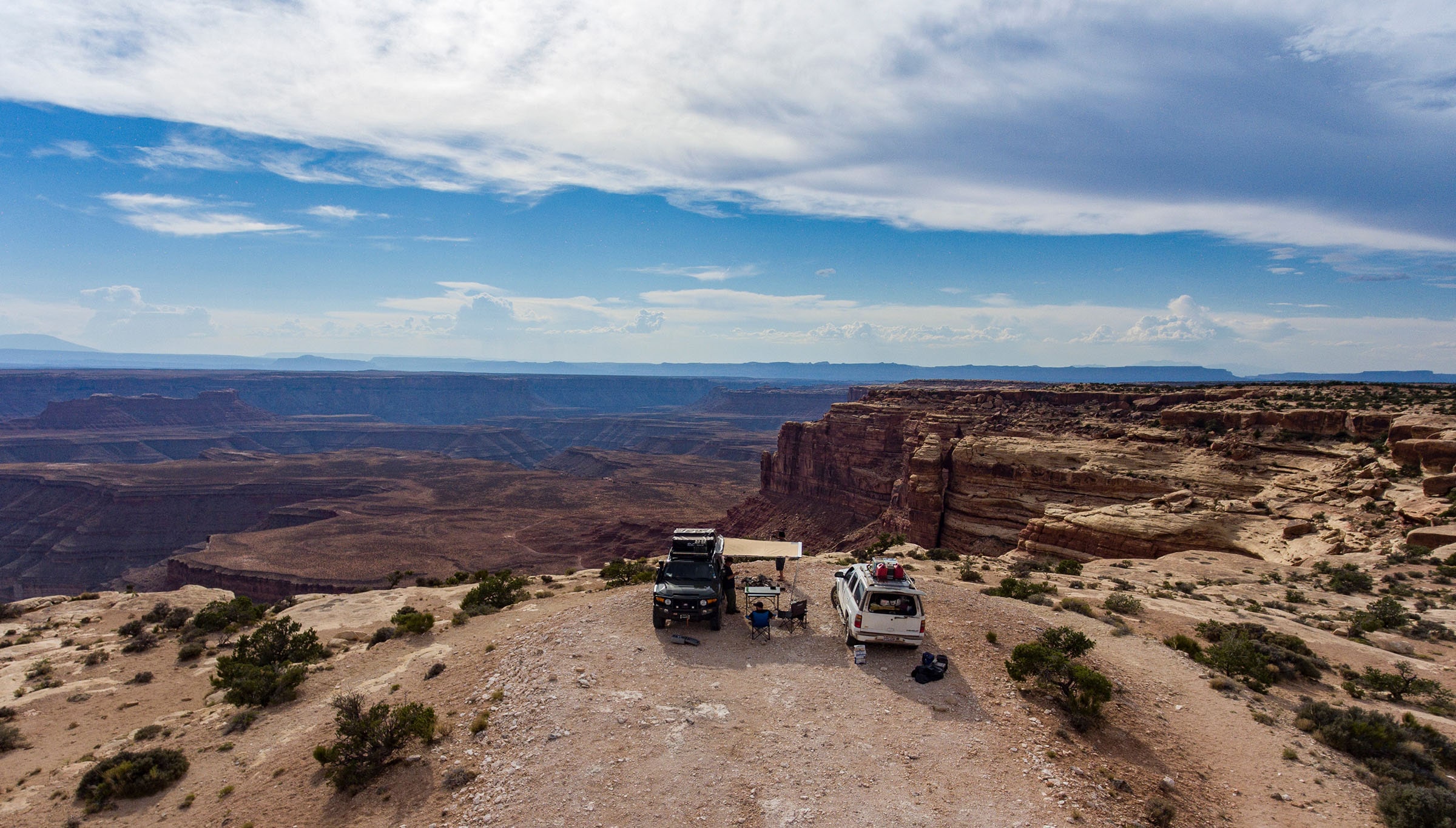 SUVs parked at edge of canyon