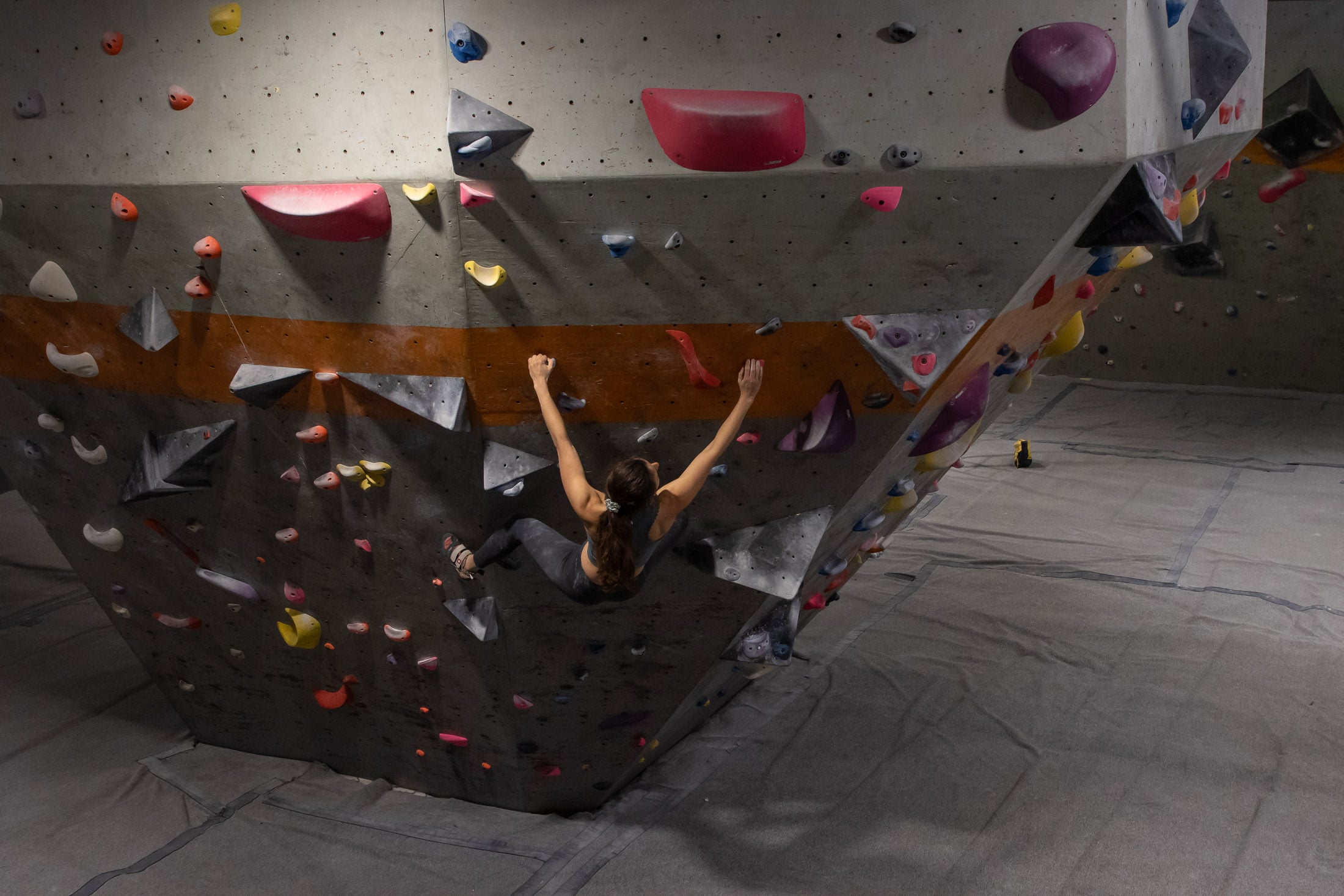 Climber on gym bouldering wall