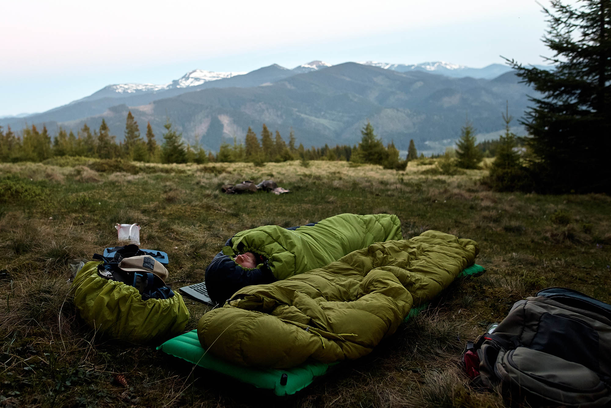 camper sleeping rough in the wilderness