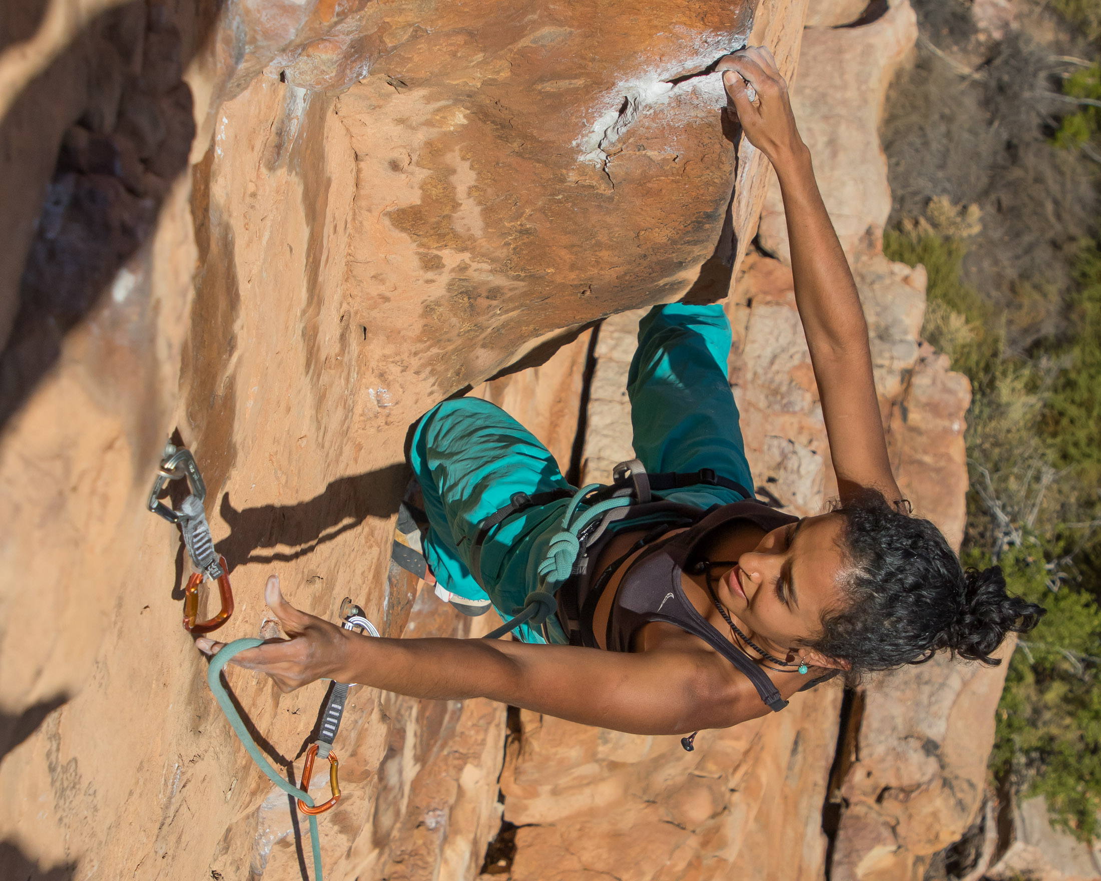 Climber redpointing a hard route with thin rope