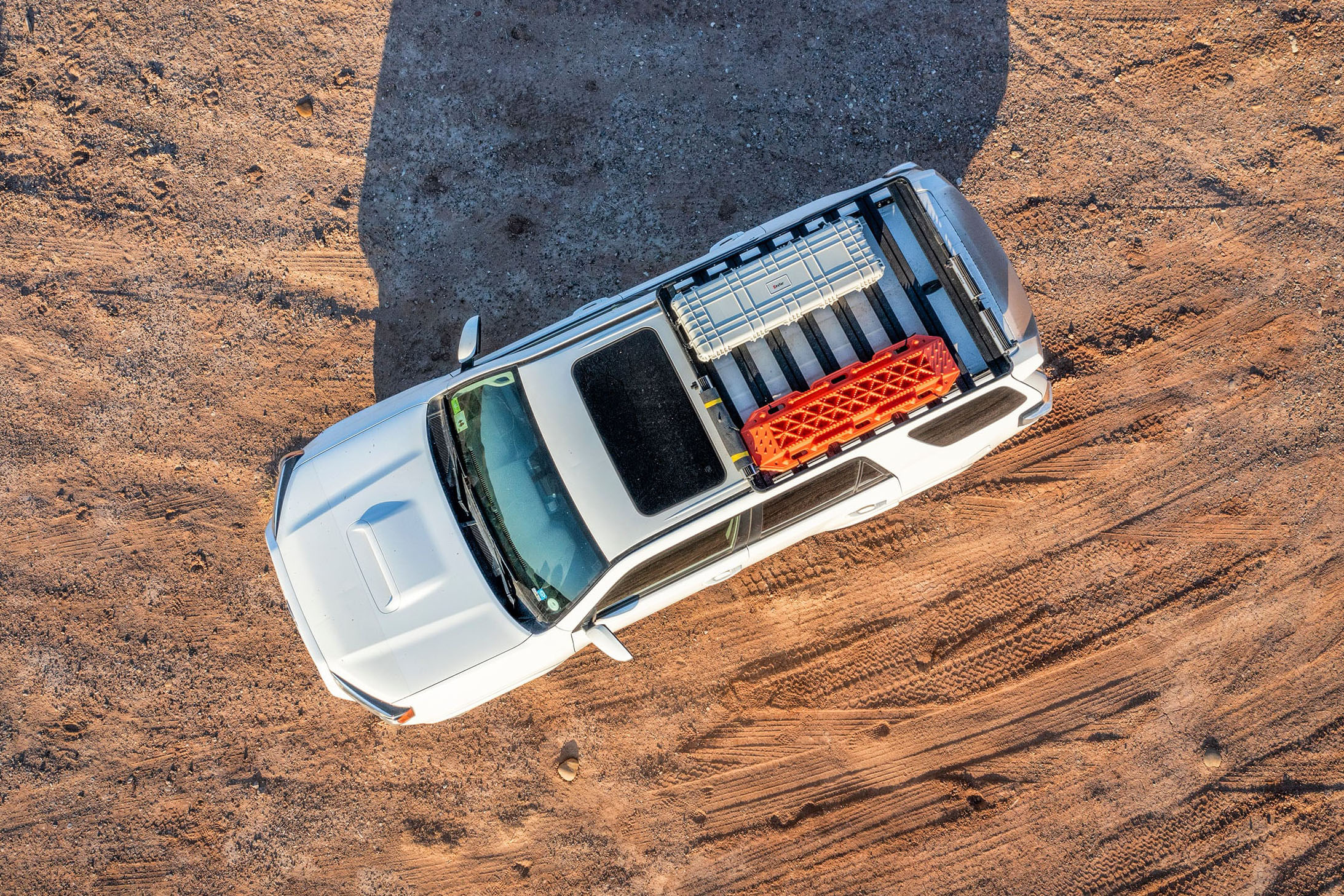 bird’s eye view of white SUV with roofrack