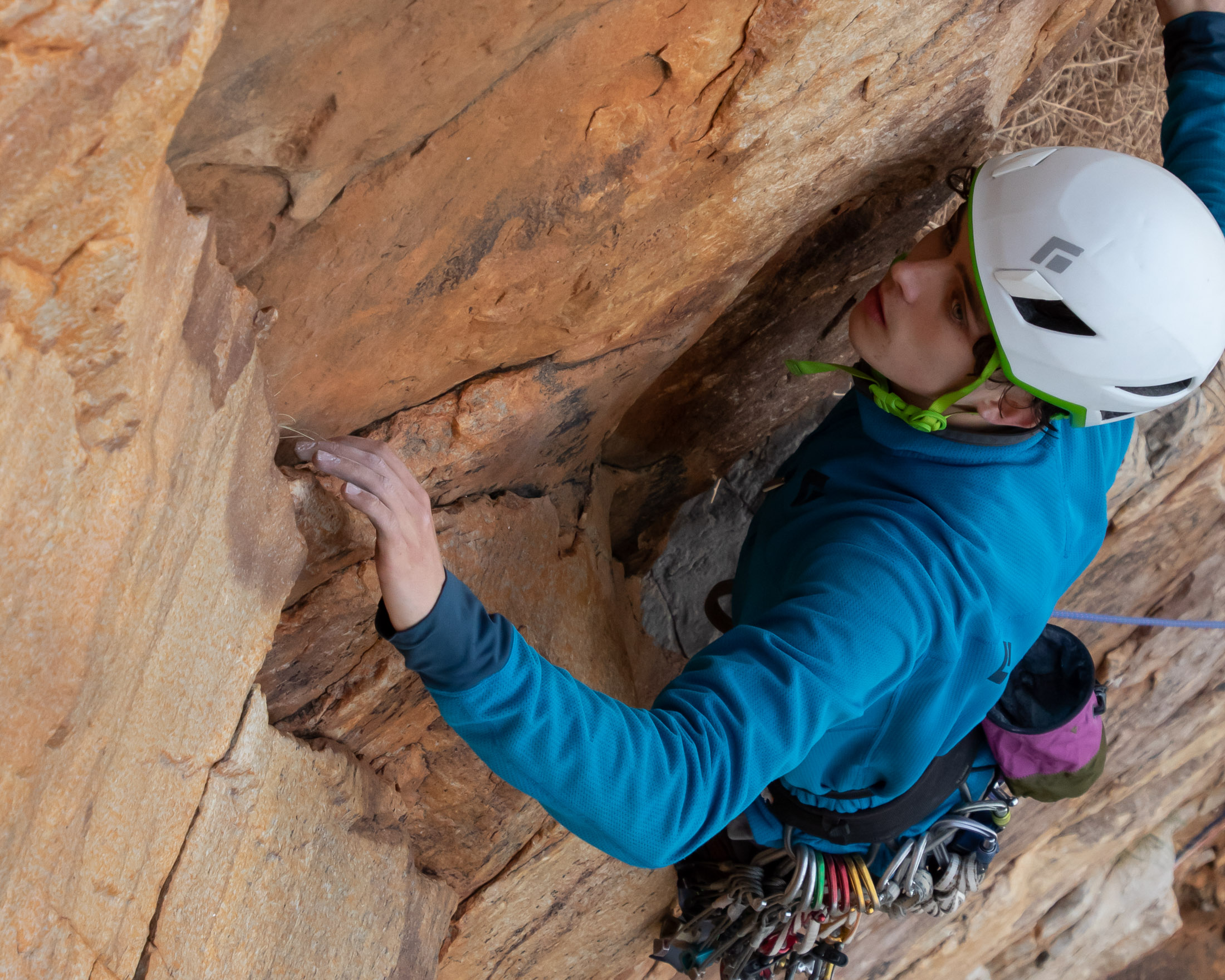 climber inspecting rock