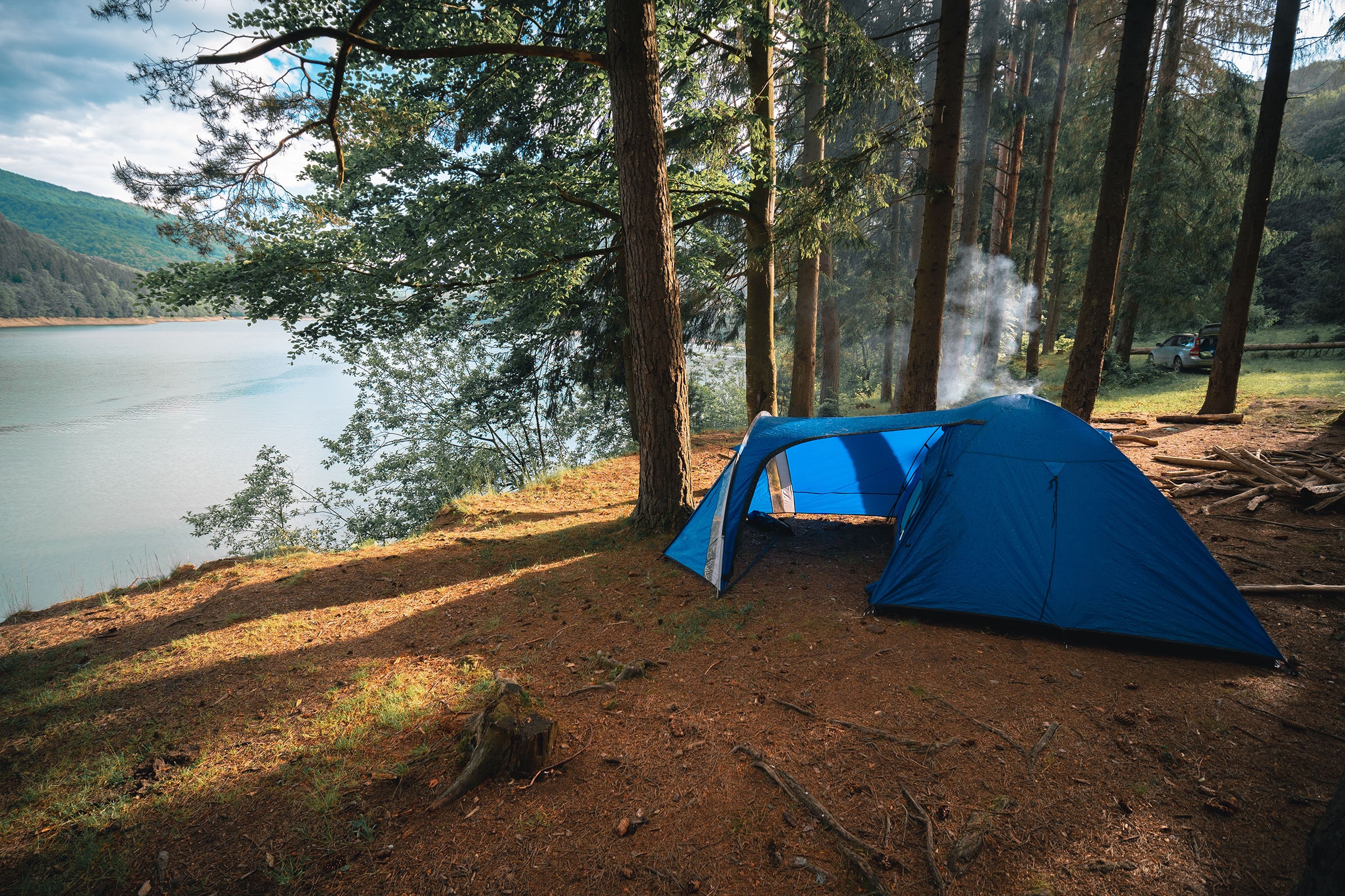 tent pitched on shore of mountain lake