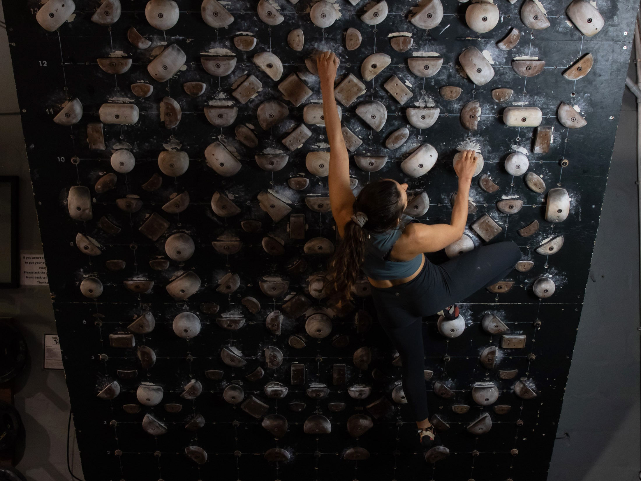 Climber training on systems board