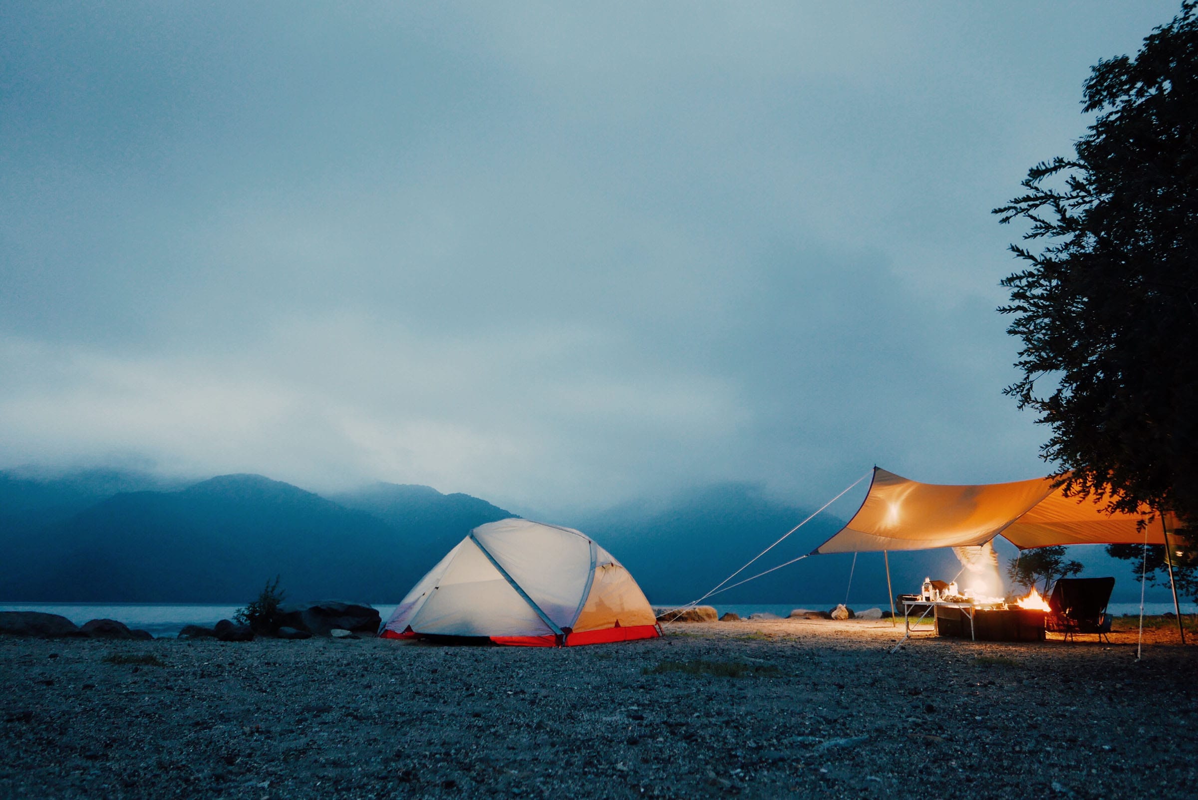 a camp with a separate tarp for the kitchen area