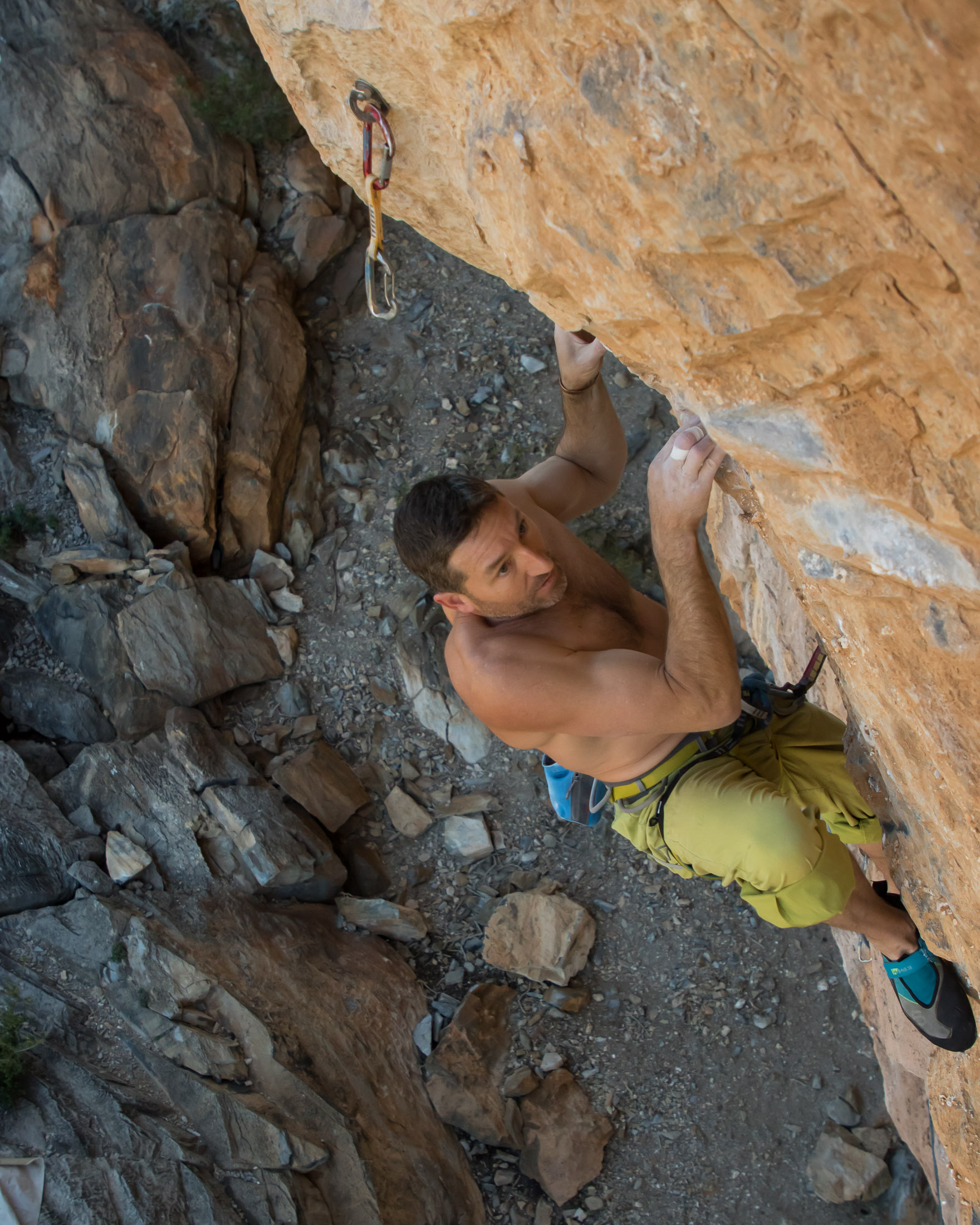 climber pulling hard through crux