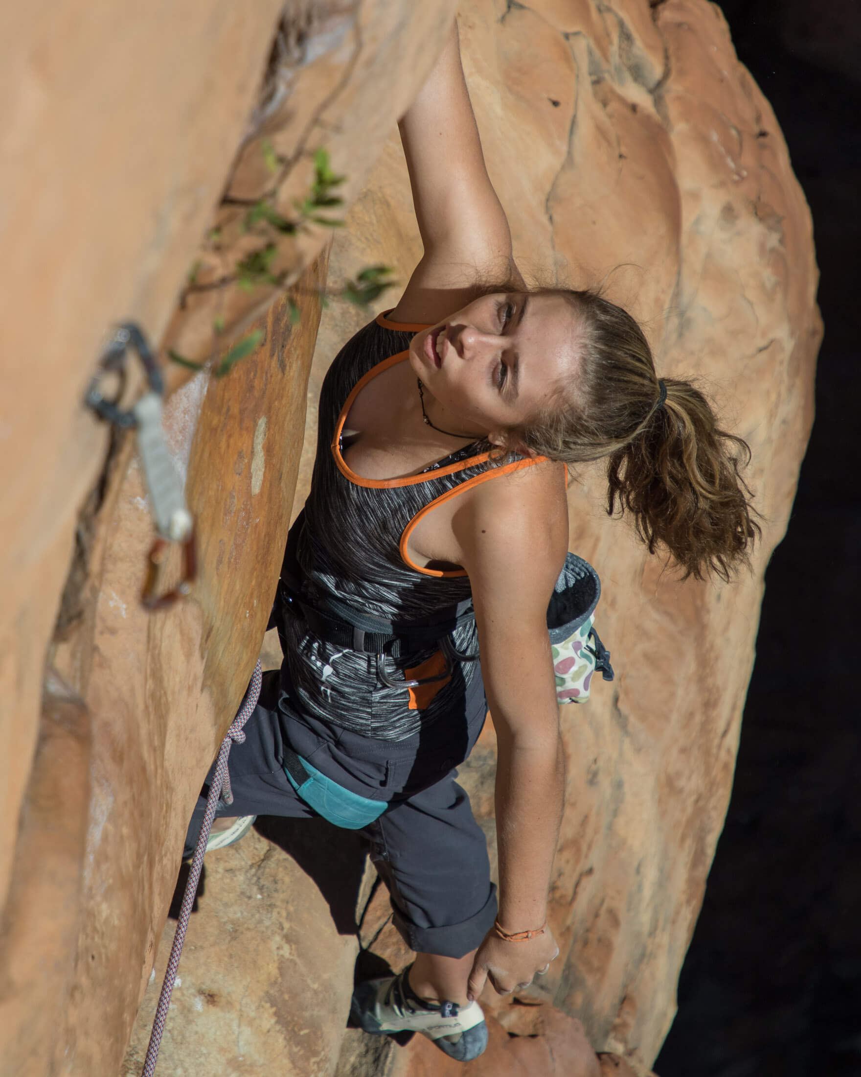 a climber catches a mid-route breather