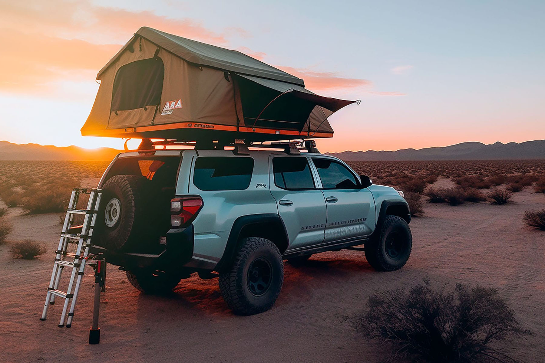 SUV with rooftop tent in desert