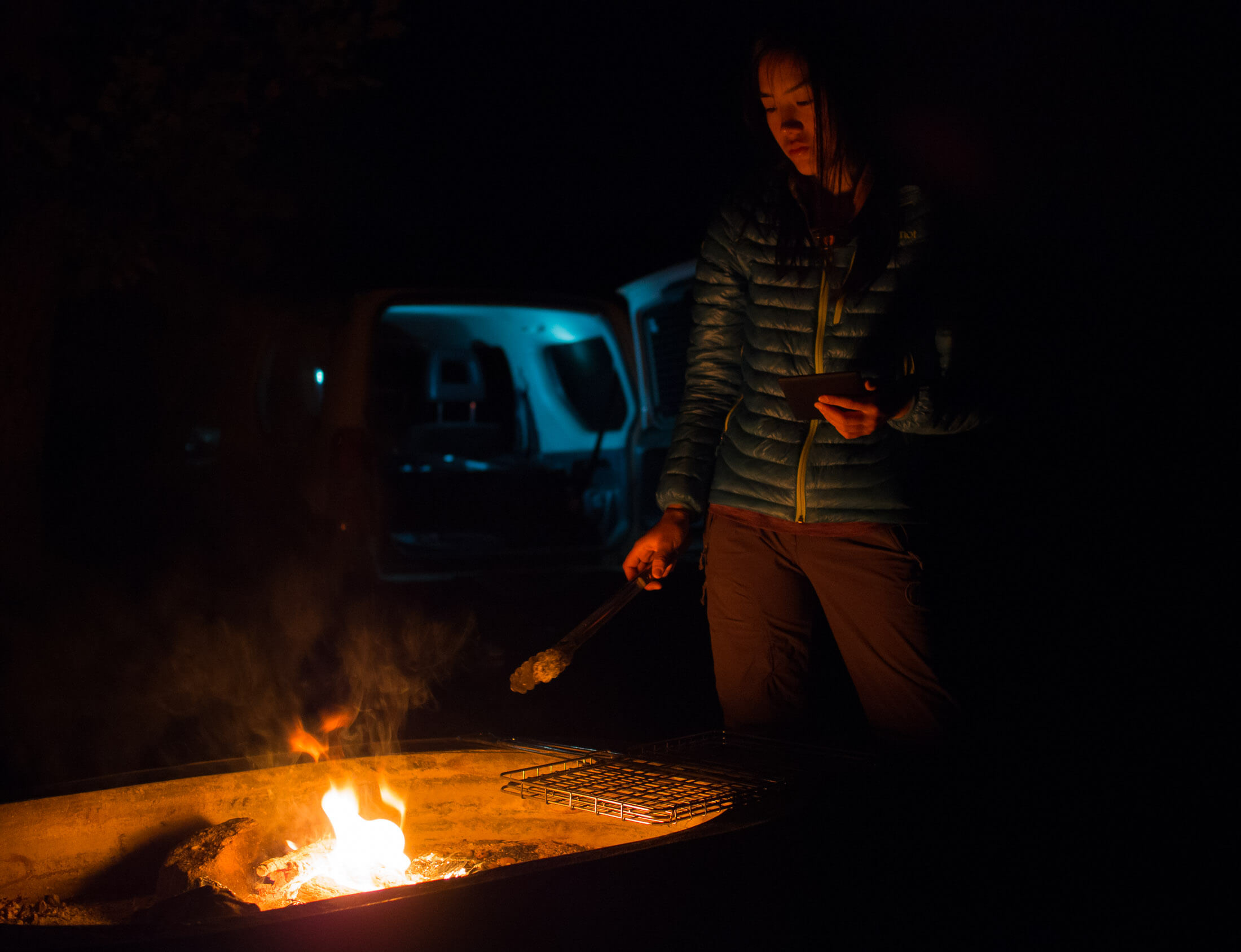 camper enjoying campfire