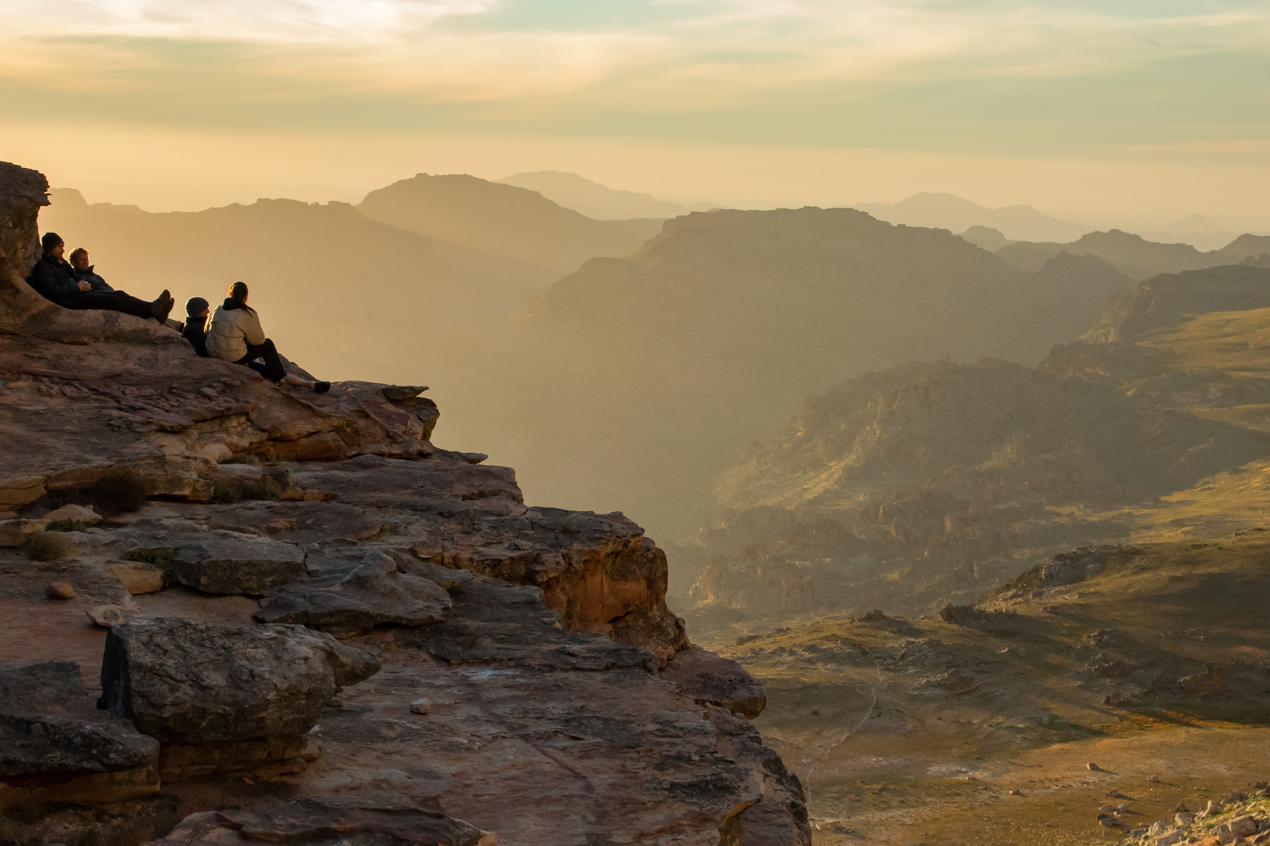 climbers enjoying view from cave in the mountains