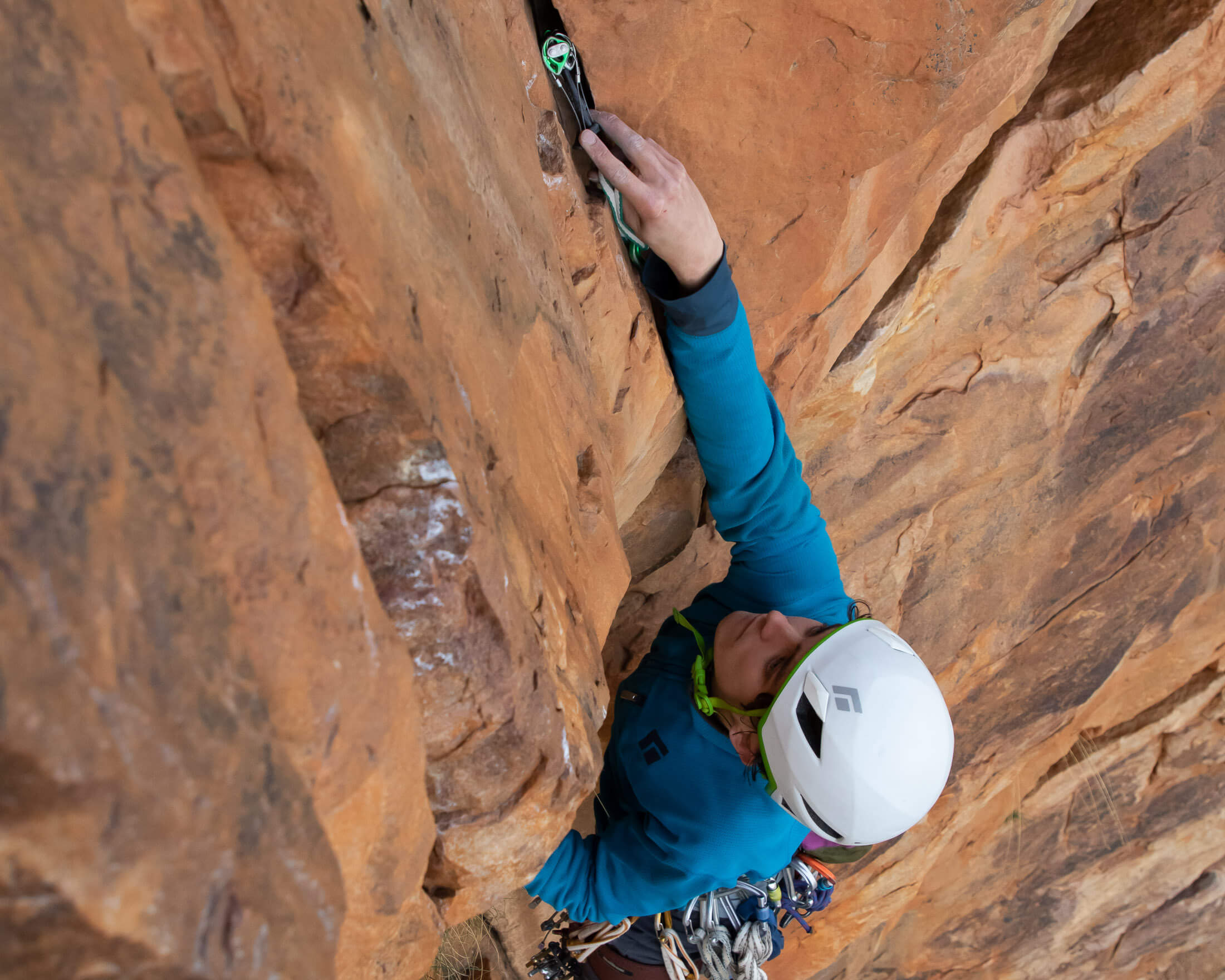 climber placing cam