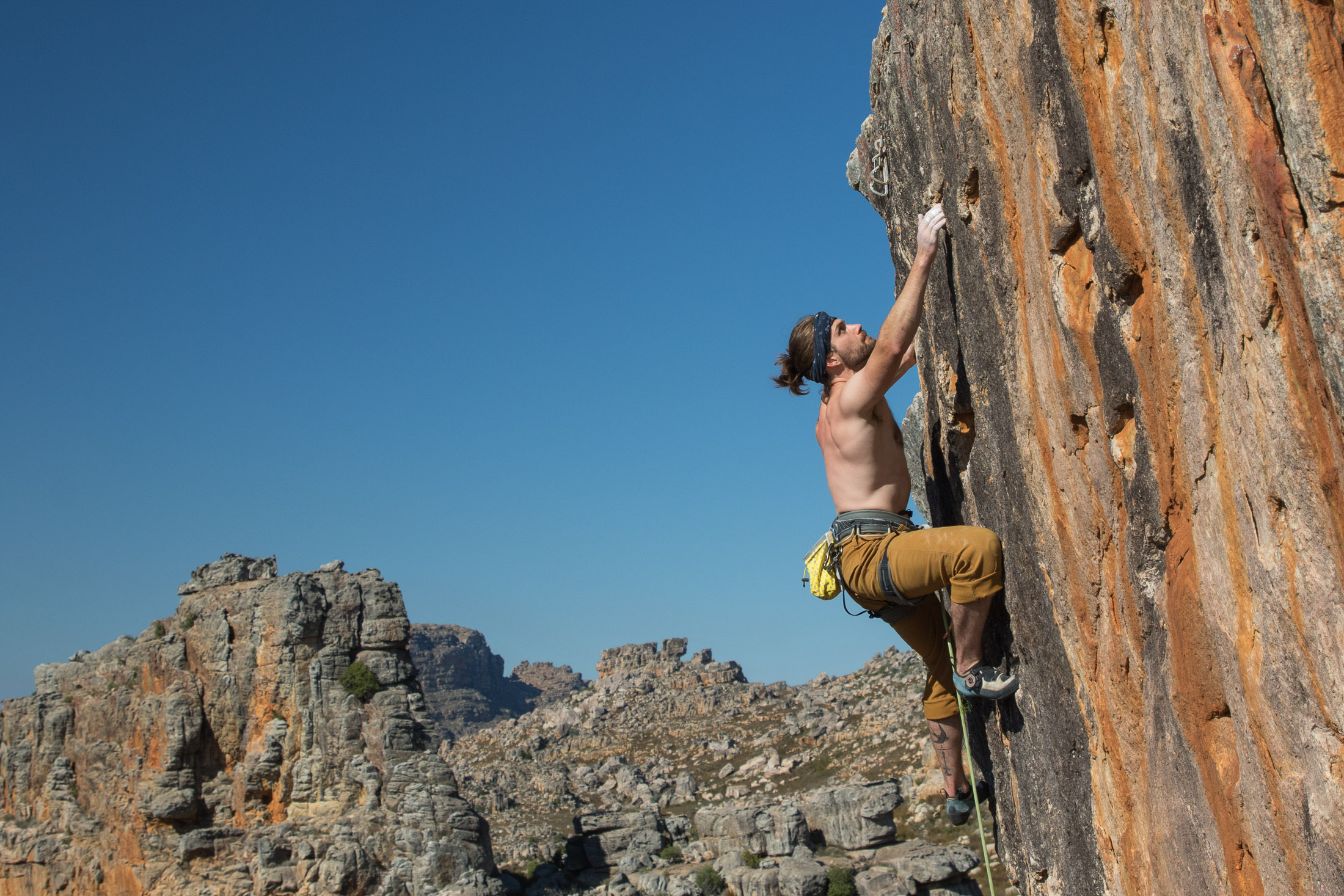 climber redpointing hard sport route