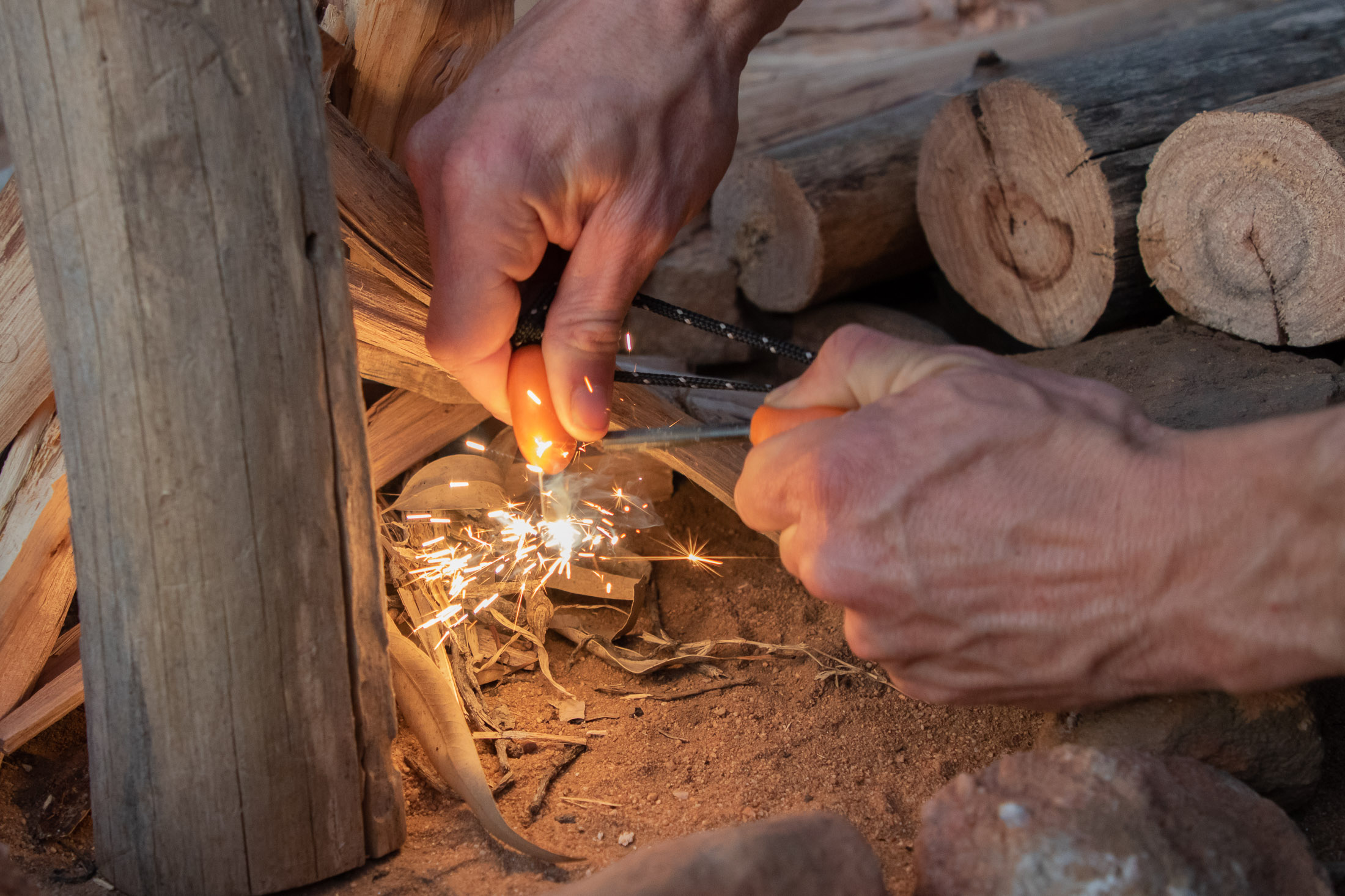 lighting a fire with a flint striker