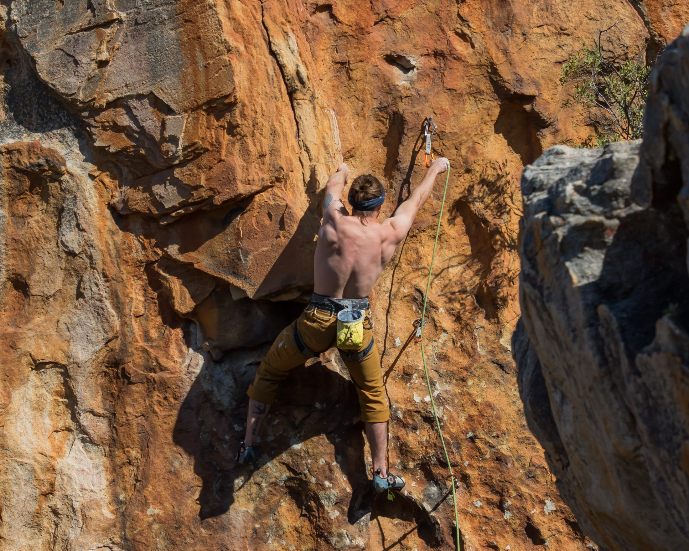 climber clipping quickdraw