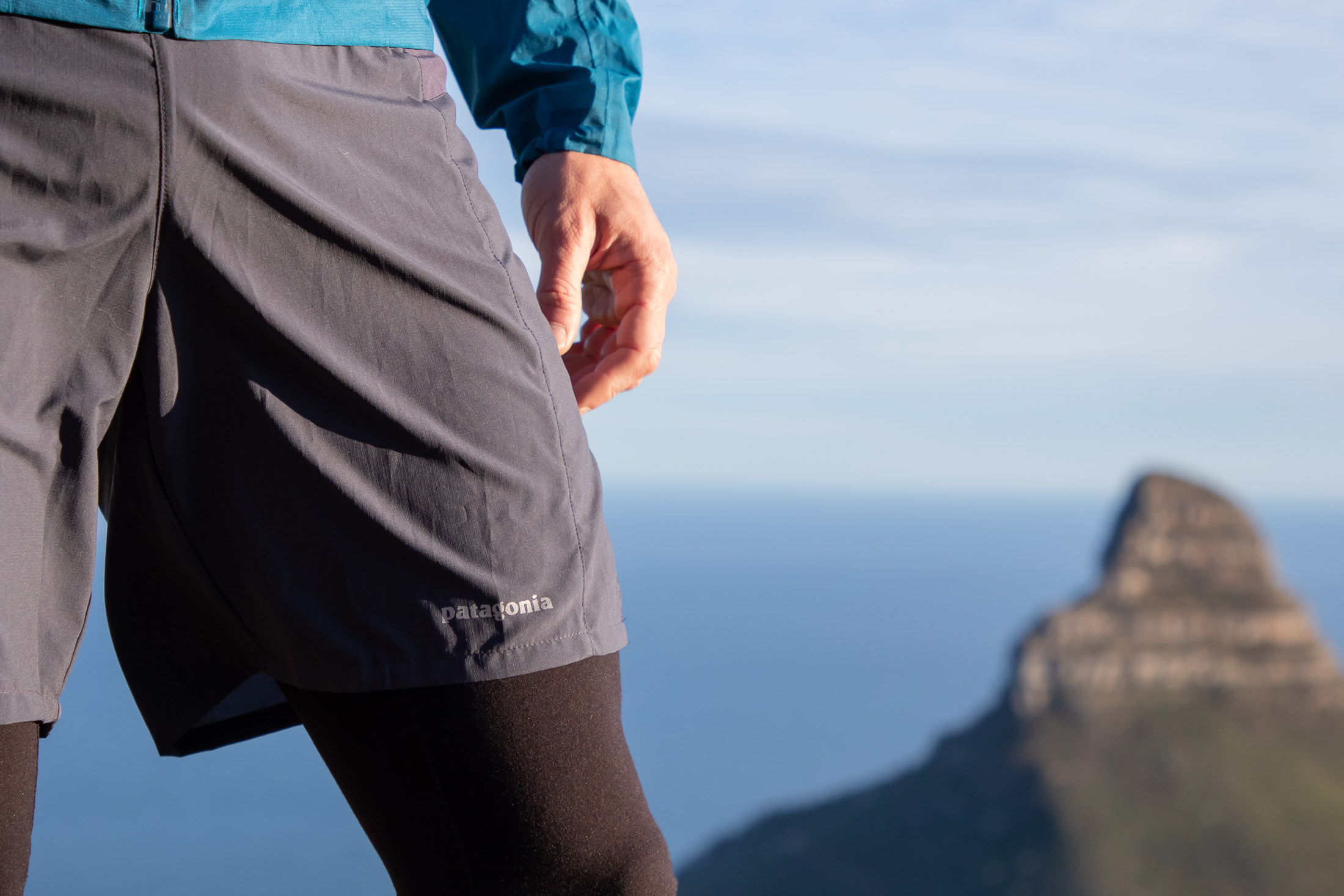 male runner wearing shorts over tights