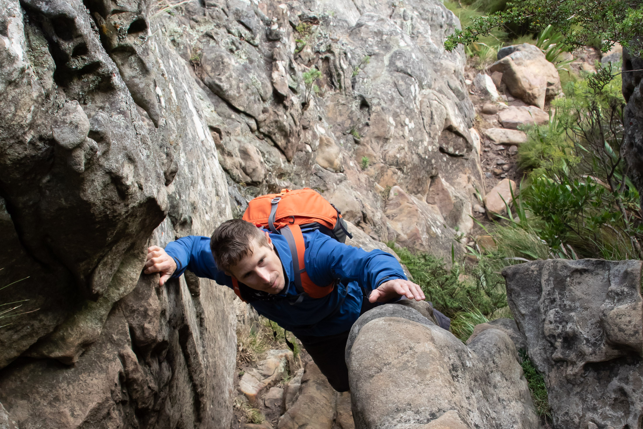 scrambler climbing up inside of narrow passage