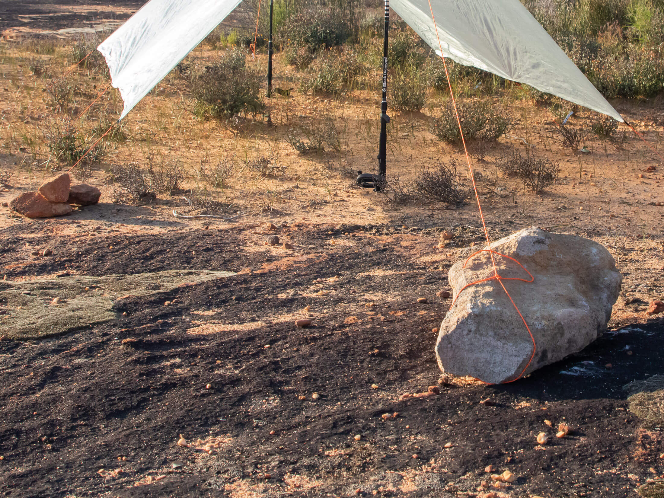 rocks used as anchor for tarp