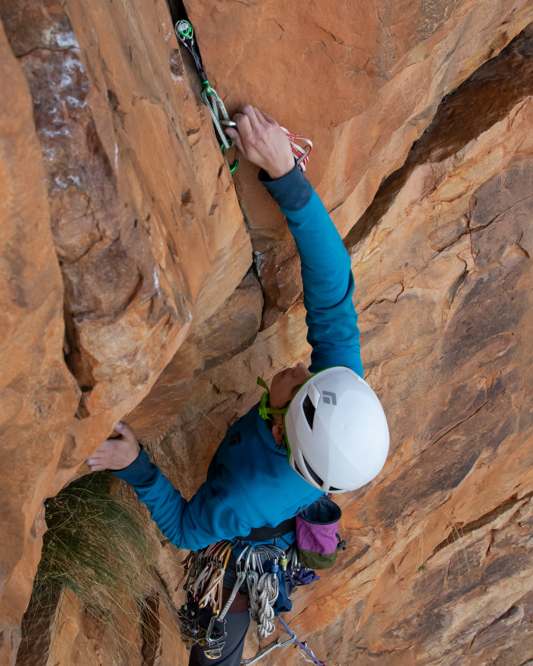 climber placing a cam