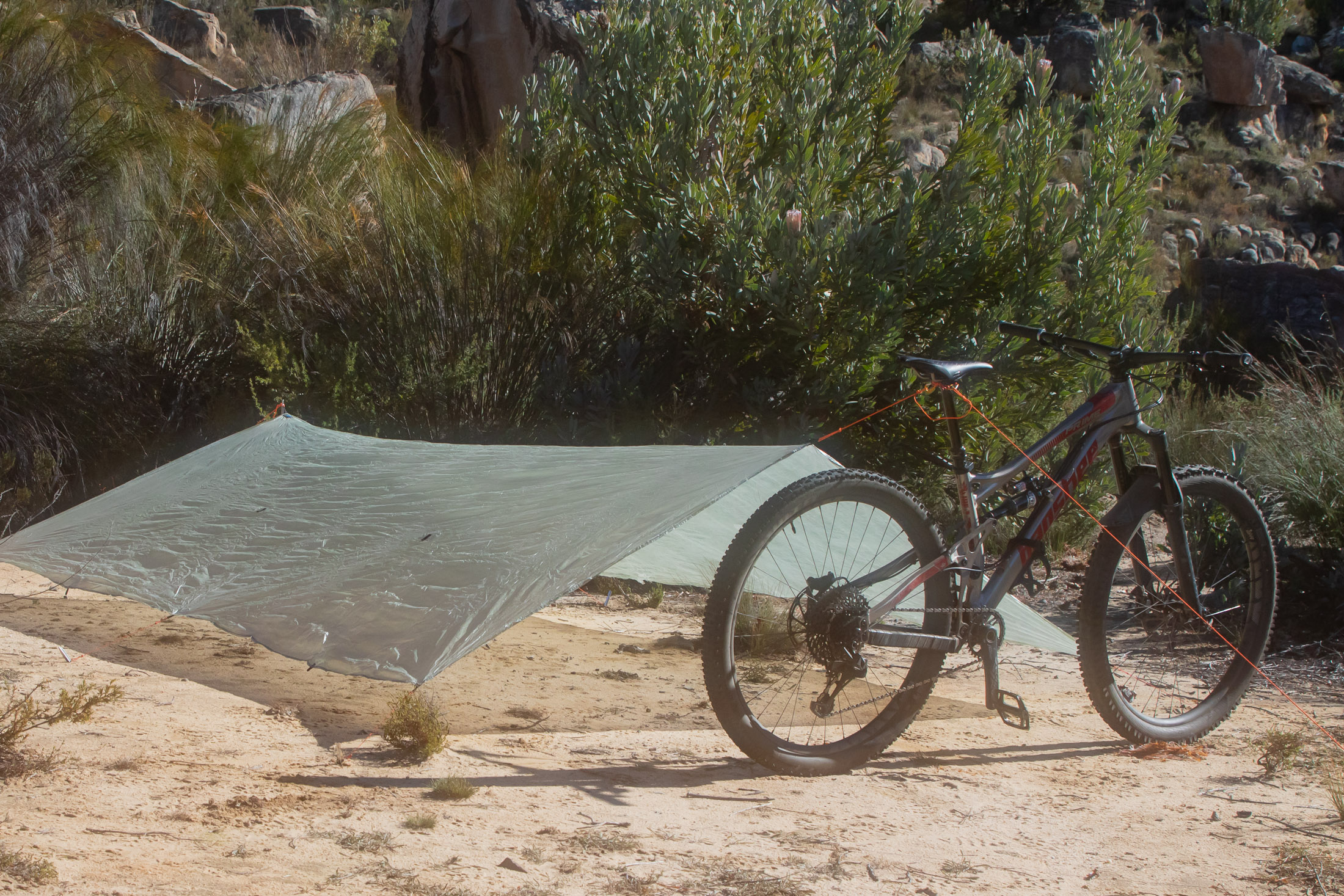 tarp supported with bike and tent pole