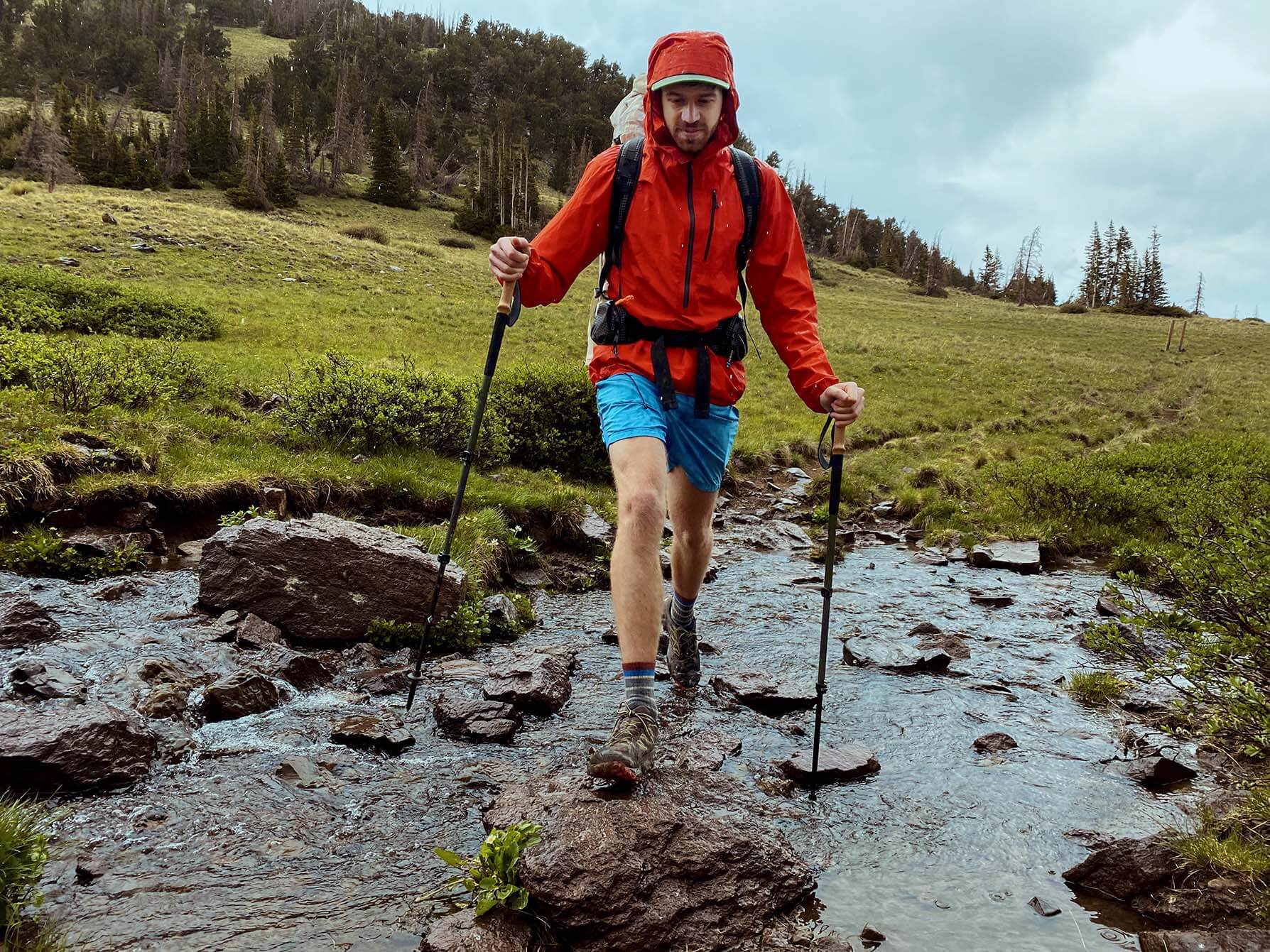 man hiking in rain