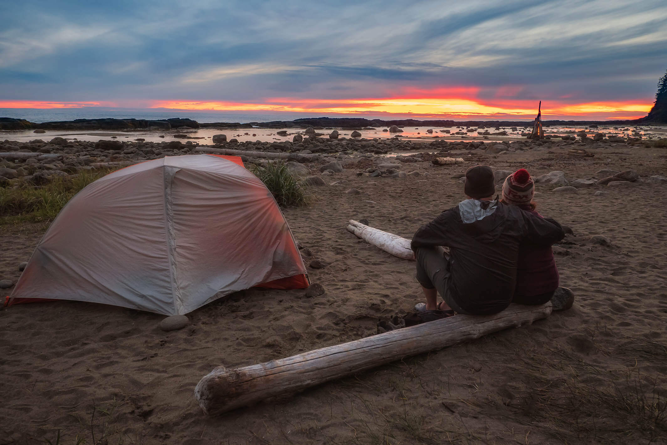 beach campsite at sunset