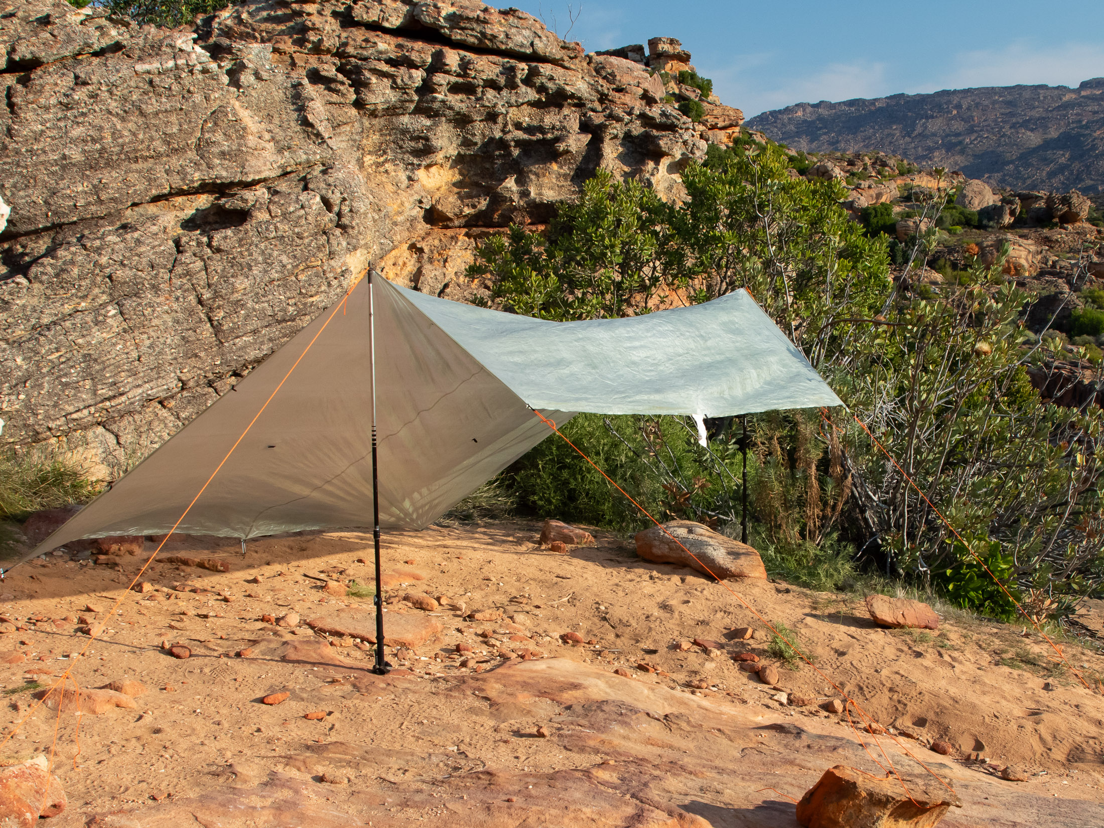 flat tarp rigged in lean-to configuration