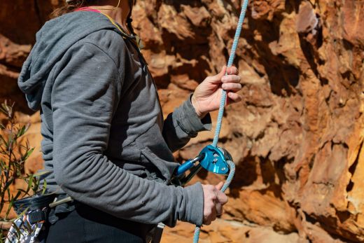 climber belaying with dry rope