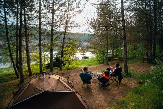 Campers relaxing while enjoying the view from their campsite