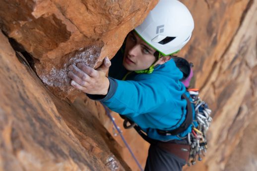 climber leading trad route