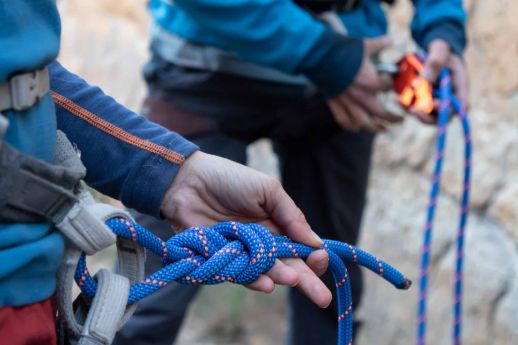 climbers inspecting rope