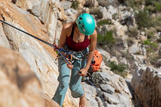 Climber rappelling with tag line